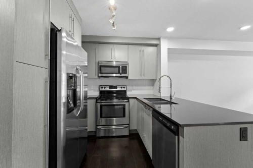 2408-11 Mahogany Row Se, Calgary, AB - Indoor Photo Showing Kitchen With Double Sink With Upgraded Kitchen