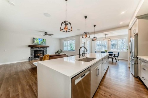 99 Legacy Glen Terrace Se, Calgary, AB - Indoor Photo Showing Kitchen With Fireplace With Upgraded Kitchen