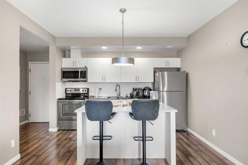208-4818 Varsity Drive Nw, Calgary, AB - Indoor Photo Showing Kitchen With Stainless Steel Kitchen