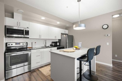 208-4818 Varsity Drive Nw, Calgary, AB - Indoor Photo Showing Kitchen With Stainless Steel Kitchen With Upgraded Kitchen