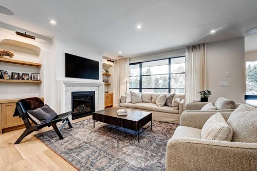 6755 Livingstone Drive Sw, Calgary, AB - Indoor Photo Showing Living Room With Fireplace