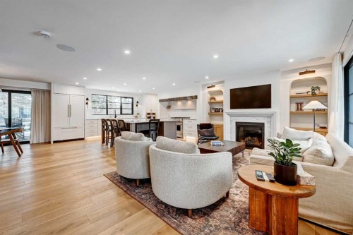 6755 Livingstone Drive Sw, Calgary, AB - Indoor Photo Showing Living Room With Fireplace