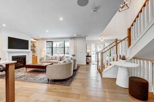 6755 Livingstone Drive Sw, Calgary, AB - Indoor Photo Showing Living Room With Fireplace