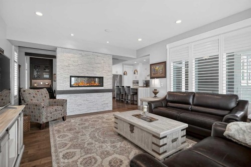 616 Coopers Crescent Sw, Airdrie, AB - Indoor Photo Showing Living Room With Fireplace