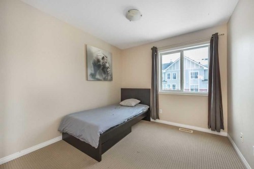 1005 New Brighton Gardens Se, Calgary, AB - Indoor Photo Showing Bedroom