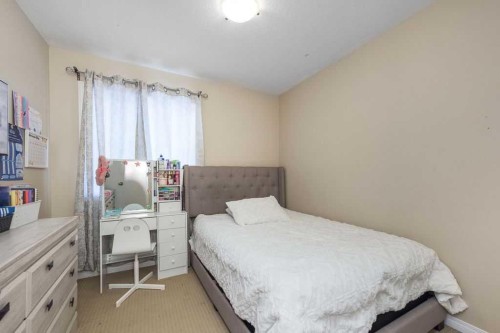 1005 New Brighton Gardens Se, Calgary, AB - Indoor Photo Showing Bedroom