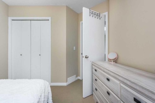 1005 New Brighton Gardens Se, Calgary, AB - Indoor Photo Showing Bedroom