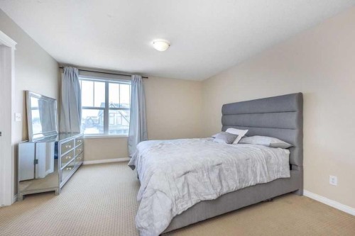 1005 New Brighton Gardens Se, Calgary, AB - Indoor Photo Showing Bedroom