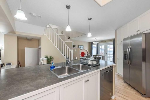 1005 New Brighton Gardens Se, Calgary, AB - Indoor Photo Showing Kitchen With Double Sink
