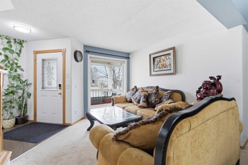 83 Coral Springs Grove Ne, Calgary, AB - Indoor Photo Showing Living Room