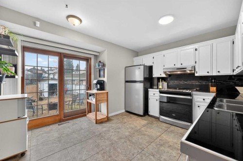 103 Macewan Drive Nw, Calgary, AB - Indoor Photo Showing Kitchen With Double Sink