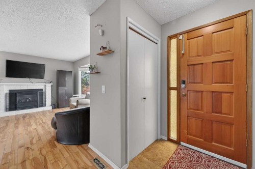 103 Macewan Drive Nw, Calgary, AB - Indoor With Fireplace