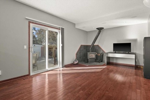 244 Ranchridge Bay Nw, Calgary, AB - Indoor With Fireplace