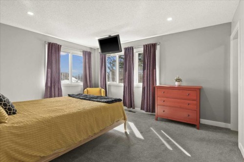 244 Ranchridge Bay Nw, Calgary, AB - Indoor Photo Showing Bedroom