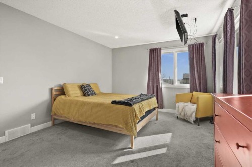 244 Ranchridge Bay Nw, Calgary, AB - Indoor Photo Showing Bedroom