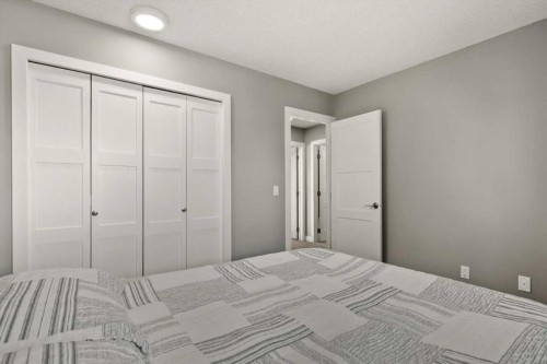 244 Ranchridge Bay Nw, Calgary, AB - Indoor Photo Showing Bedroom