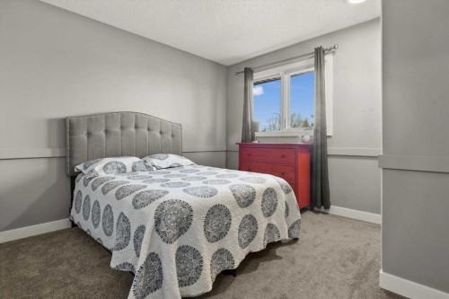 244 Ranchridge Bay Nw, Calgary, AB - Indoor Photo Showing Bedroom