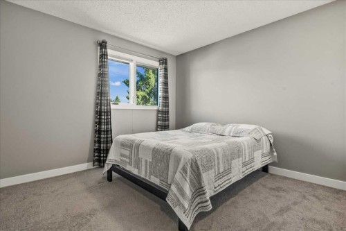 244 Ranchridge Bay Nw, Calgary, AB - Indoor Photo Showing Bedroom