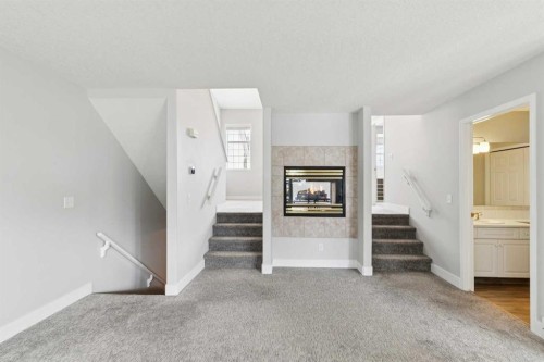 328 Prominence Heights Sw, Calgary, AB - Indoor With Fireplace
