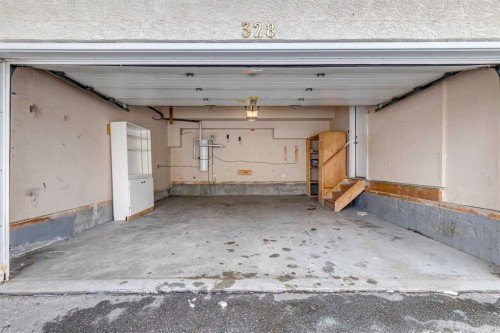 328 Prominence Heights Sw, Calgary, AB - Indoor Photo Showing Garage