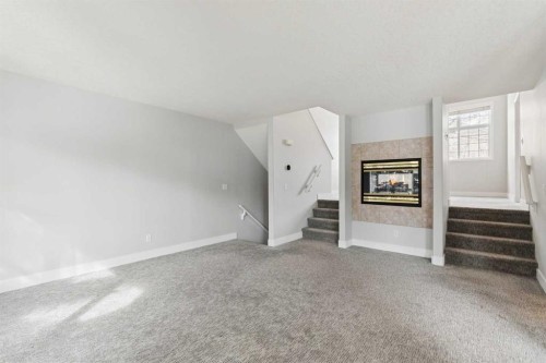328 Prominence Heights Sw, Calgary, AB - Indoor With Fireplace