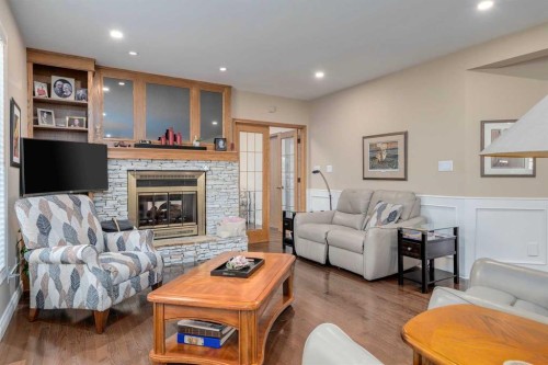 88 Woodacres Drive Sw, Calgary, AB - Indoor Photo Showing Living Room With Fireplace
