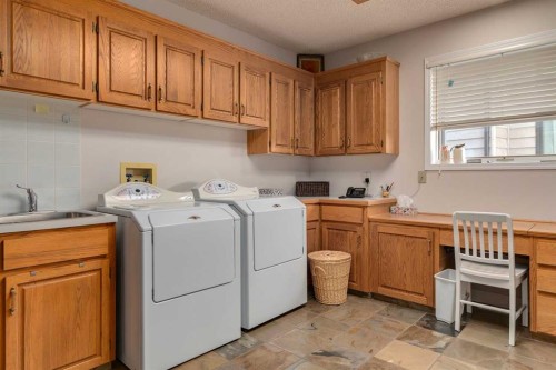 88 Woodacres Drive Sw, Calgary, AB - Indoor Photo Showing Laundry Room