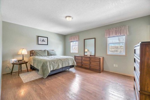 10 Valley Ridge Place Ne, Diamond Valley, AB - Indoor Photo Showing Bedroom