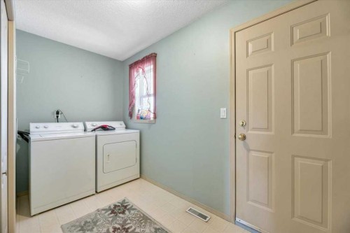 10 Valley Ridge Place Ne, Diamond Valley, AB - Indoor Photo Showing Laundry Room