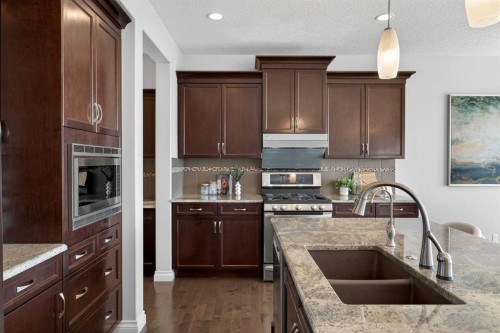 122 Springbluff Boulevard Sw, Calgary, AB - Indoor Photo Showing Kitchen With Double Sink With Upgraded Kitchen
