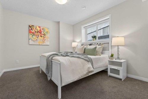 122 Springbluff Boulevard Sw, Calgary, AB - Indoor Photo Showing Bedroom