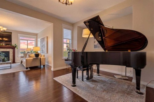 122 Springbluff Boulevard Sw, Calgary, AB - Indoor Photo Showing Other Room With Fireplace