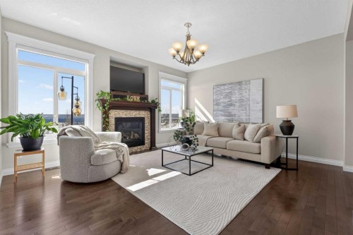 122 Springbluff Boulevard Sw, Calgary, AB - Indoor Photo Showing Living Room With Fireplace
