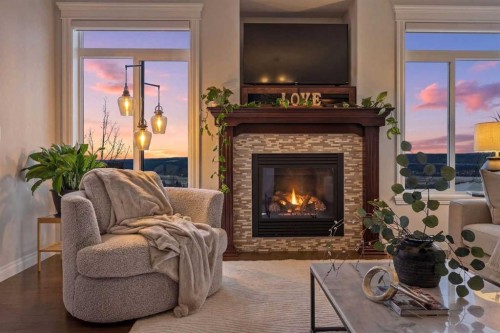 122 Springbluff Boulevard Sw, Calgary, AB - Indoor Photo Showing Living Room With Fireplace