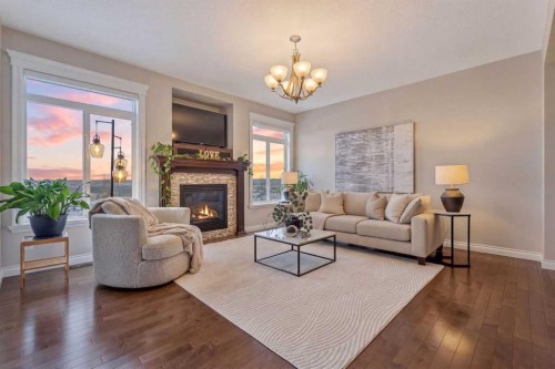122 Springbluff Boulevard Sw, Calgary, AB - Indoor Photo Showing Living Room With Fireplace