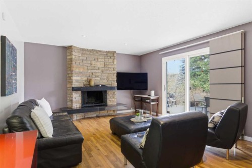 12 Varsville Place Nw, Calgary, AB - Indoor Photo Showing Living Room With Fireplace