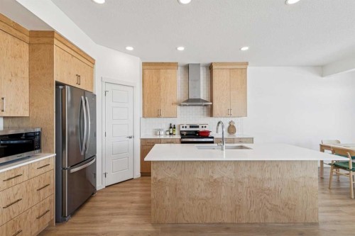 150 Lucas Close Nw, Calgary, AB - Indoor Photo Showing Kitchen With Double Sink With Upgraded Kitchen