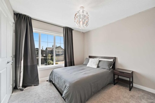 13 Cranbrook Cove Se, Calgary, AB - Indoor Photo Showing Bedroom
