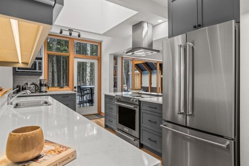 18 Pinewood Crescent, Canmore, AB - Indoor Photo Showing Kitchen With Stainless Steel Kitchen With Double Sink With Upgraded Kitchen