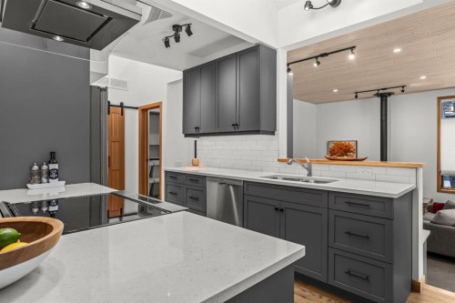 18 Pinewood Crescent, Canmore, AB - Indoor Photo Showing Kitchen With Double Sink