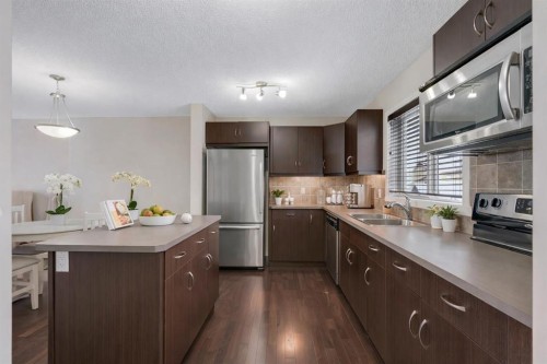 124 Panamount Way Nw, Calgary, AB - Indoor Photo Showing Kitchen With Stainless Steel Kitchen With Double Sink