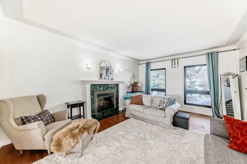 40 Christie Cairn Square Sw, Calgary, AB - Indoor Photo Showing Living Room With Fireplace