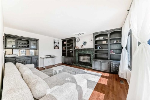 40 Christie Cairn Square Sw, Calgary, AB - Indoor Photo Showing Living Room With Fireplace