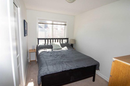 132 Copperpond Boulevard Se, Calgary, AB - Indoor Photo Showing Bedroom