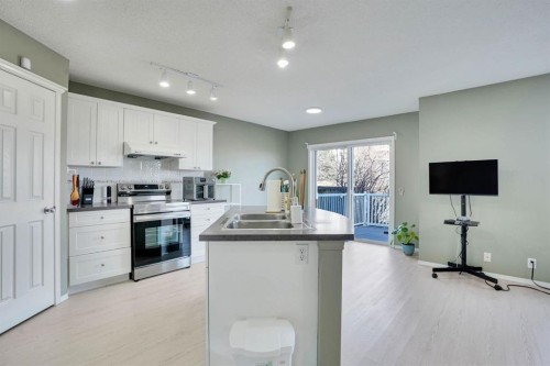 328 Tuscany Valley View Nw, Calgary, AB - Indoor Photo Showing Kitchen With Double Sink