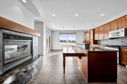 14 Springborough Crescent Sw, Calgary, AB - Indoor Photo Showing Kitchen With Fireplace