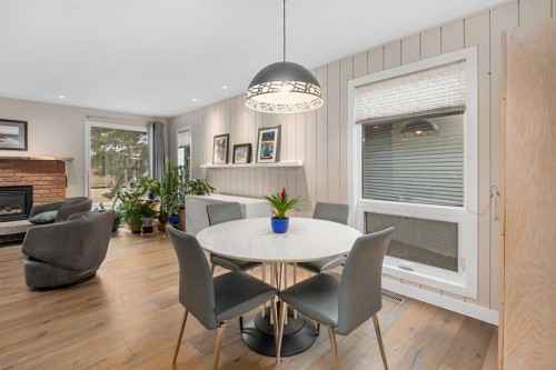 5689 Brenner Crescent Nw, Calgary, AB - Indoor Photo Showing Dining Room With Fireplace