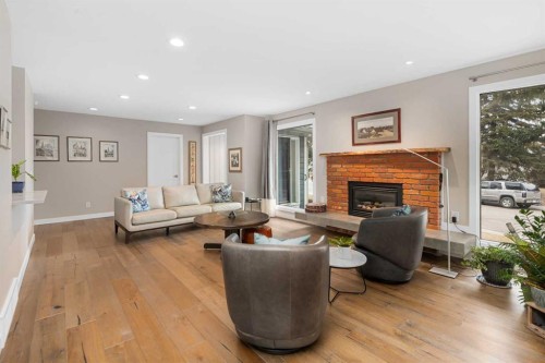 5689 Brenner Crescent Nw, Calgary, AB - Indoor Photo Showing Living Room With Fireplace