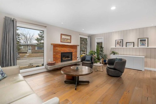 5689 Brenner Crescent Nw, Calgary, AB - Indoor Photo Showing Living Room With Fireplace