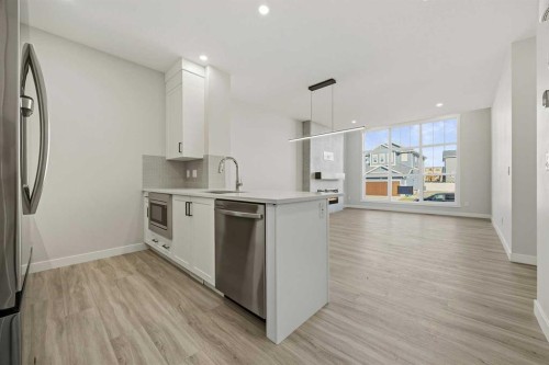 1047 Bayview Crescent, Airdrie, AB - Indoor Photo Showing Kitchen With Stainless Steel Kitchen